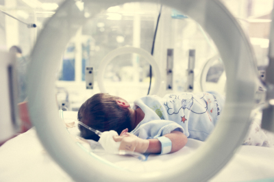 Newborn baby inside incubator